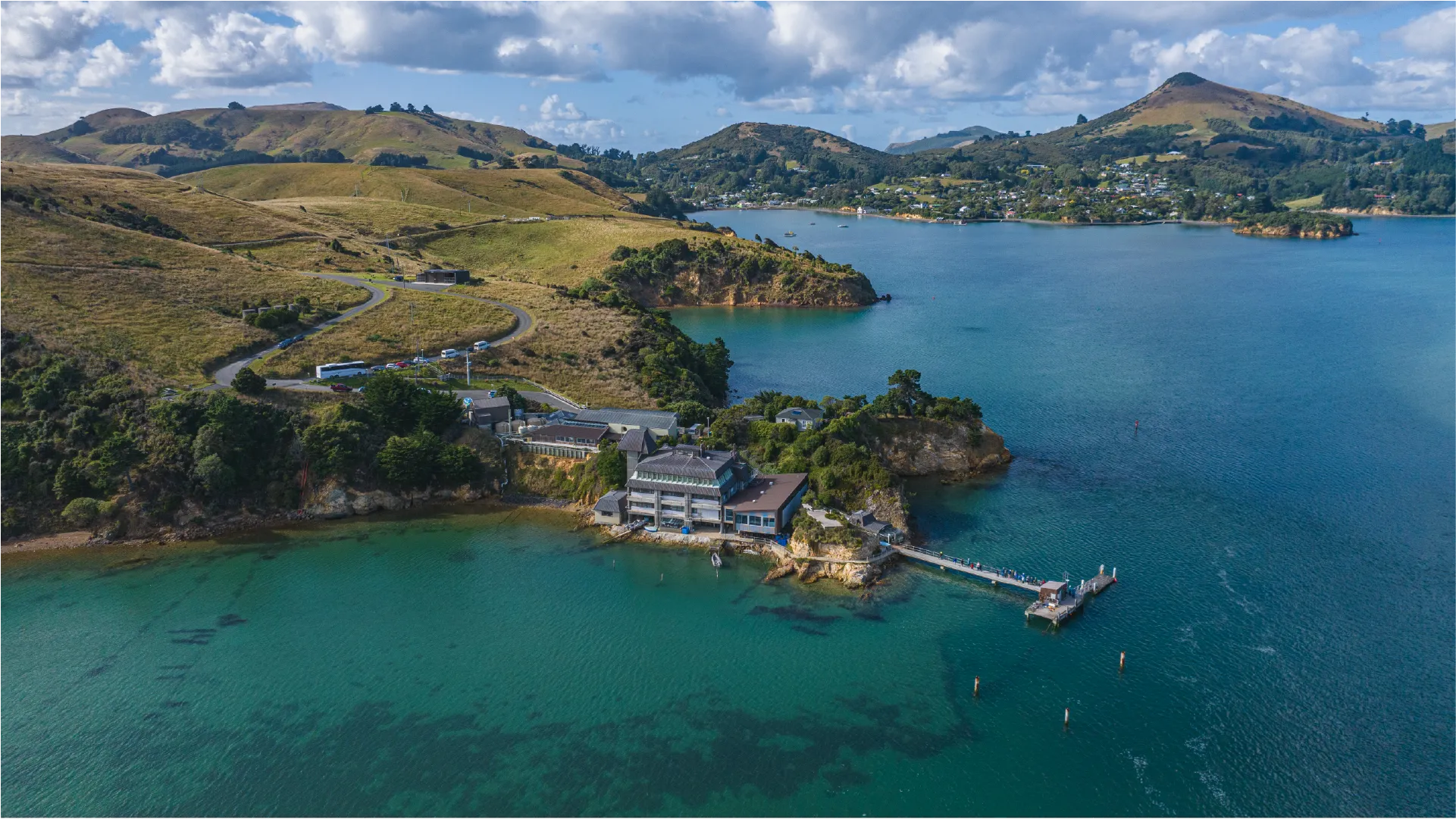 Dunedin, When the Sun Rises from the Mountain and Ocean Aerial footage of Dunedin captured at sunrise across a full year of production, from Larnach Castle and Mt Cargill to the university campus and harbour.
