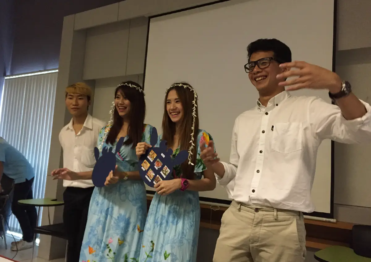 Best Uthakhamkong receiving a Best Student award or posing at Bangkok University, Thailand.