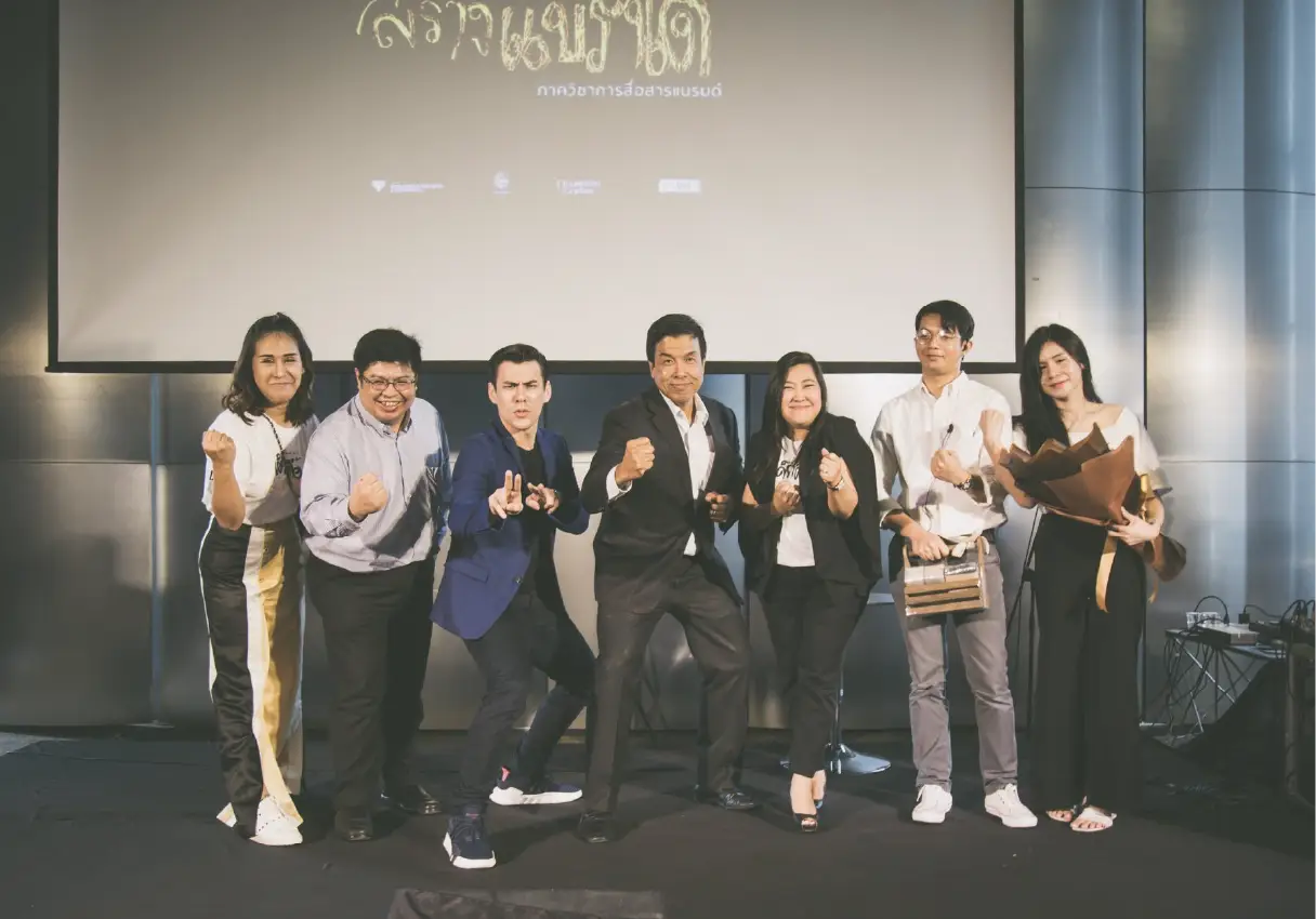 Best Uthakhamkong receiving a Best Student award or posing at Bangkok University, Thailand.